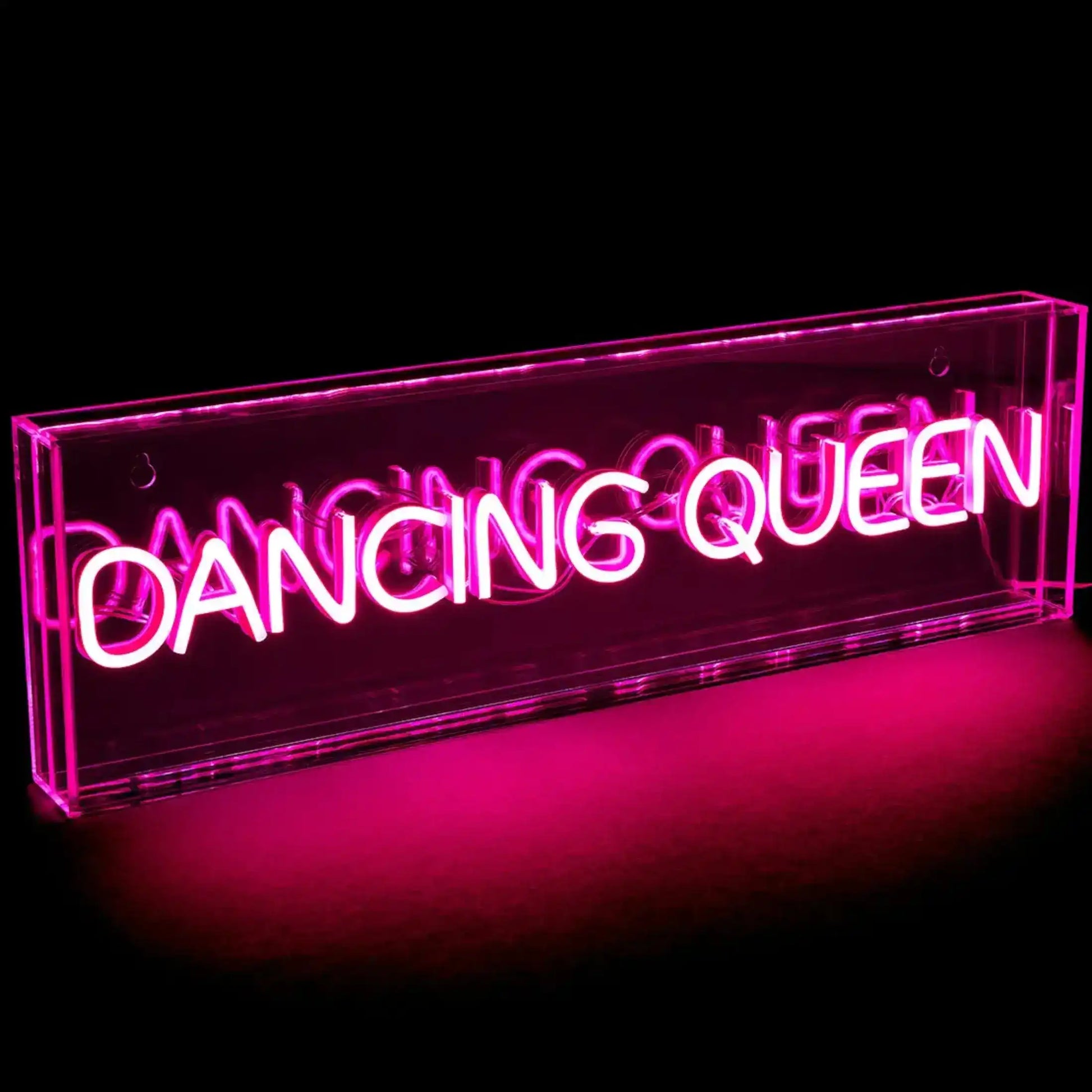 Neon sign with 'Dancing Queen' text on a black background