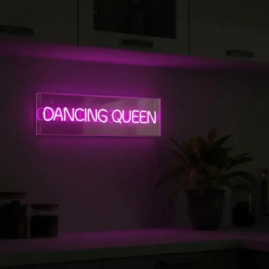 Neon sign with 'Dancing Queen' text on a dark background