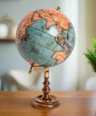 Vintage-style globe on a stand with a detailed map of the world.