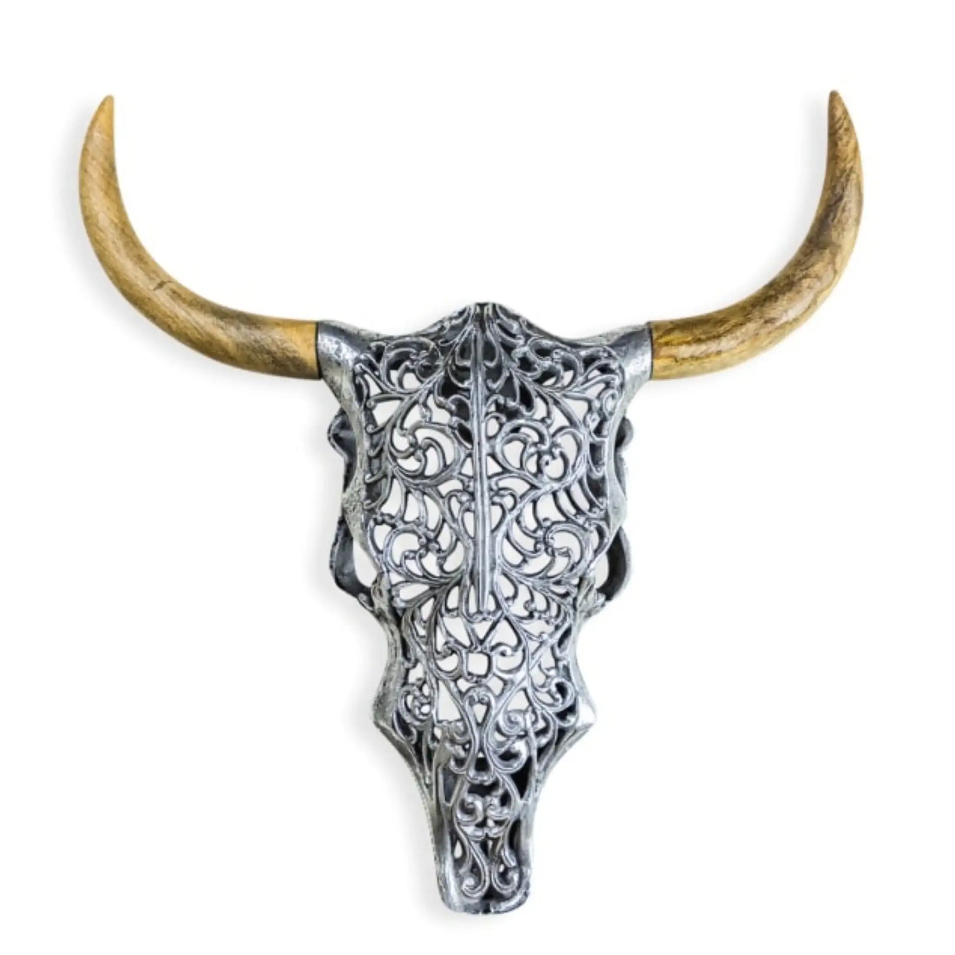 Decorative bull skull with intricate silver design and long horns on a white background
