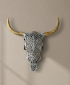 Decorative bull skull with intricate patterns on a beige background