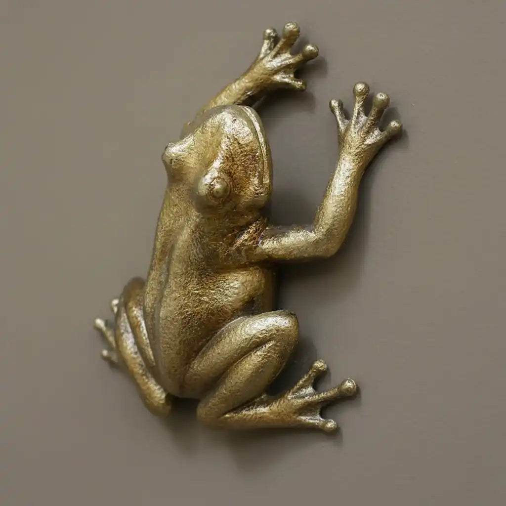 Bronze monkey figurine on a textured stone surface