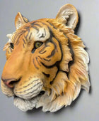 Faux tiger head mount on a dark gray background