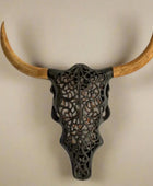 Decorative bull skull with large wooden horns on a white background