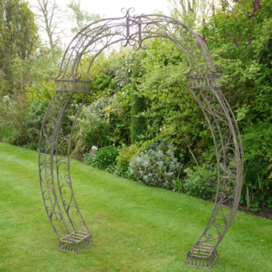 Decorative garden archway in a lush green garden setting