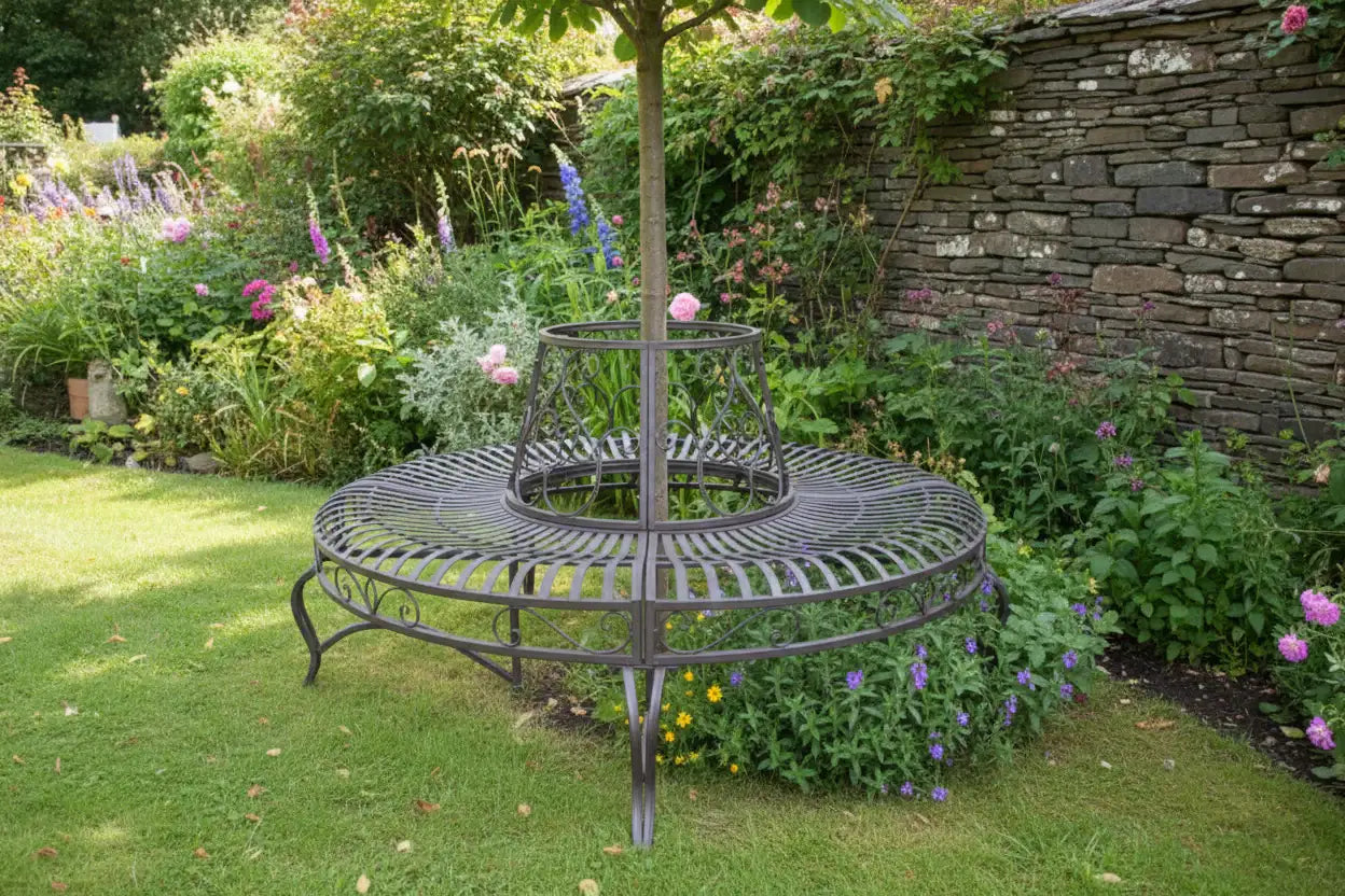 Decorative metal stand in a garden setting with flowers and a stone wall.