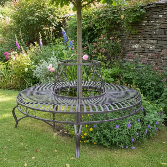 Decorative metal garden stand with plants in a garden setting