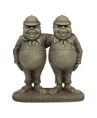 Bronze statue of two characters in suits and hats on a white background