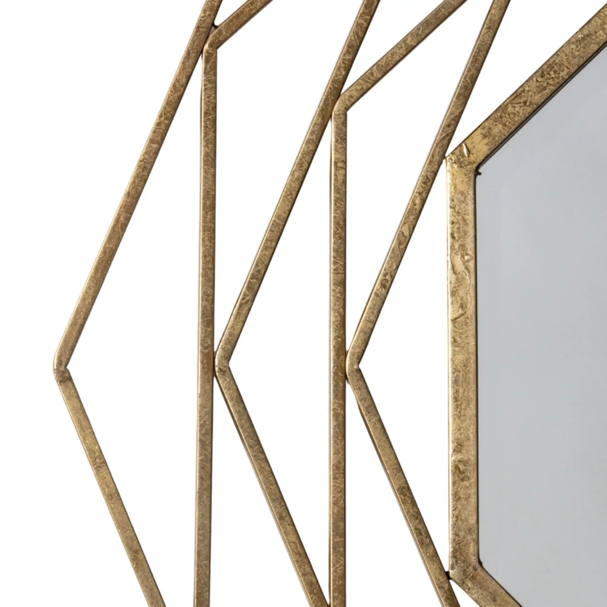 Decorative wall mirror with geometric gold frame on a white background