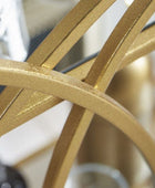 Close-up of a gold metal object with a blurred background
