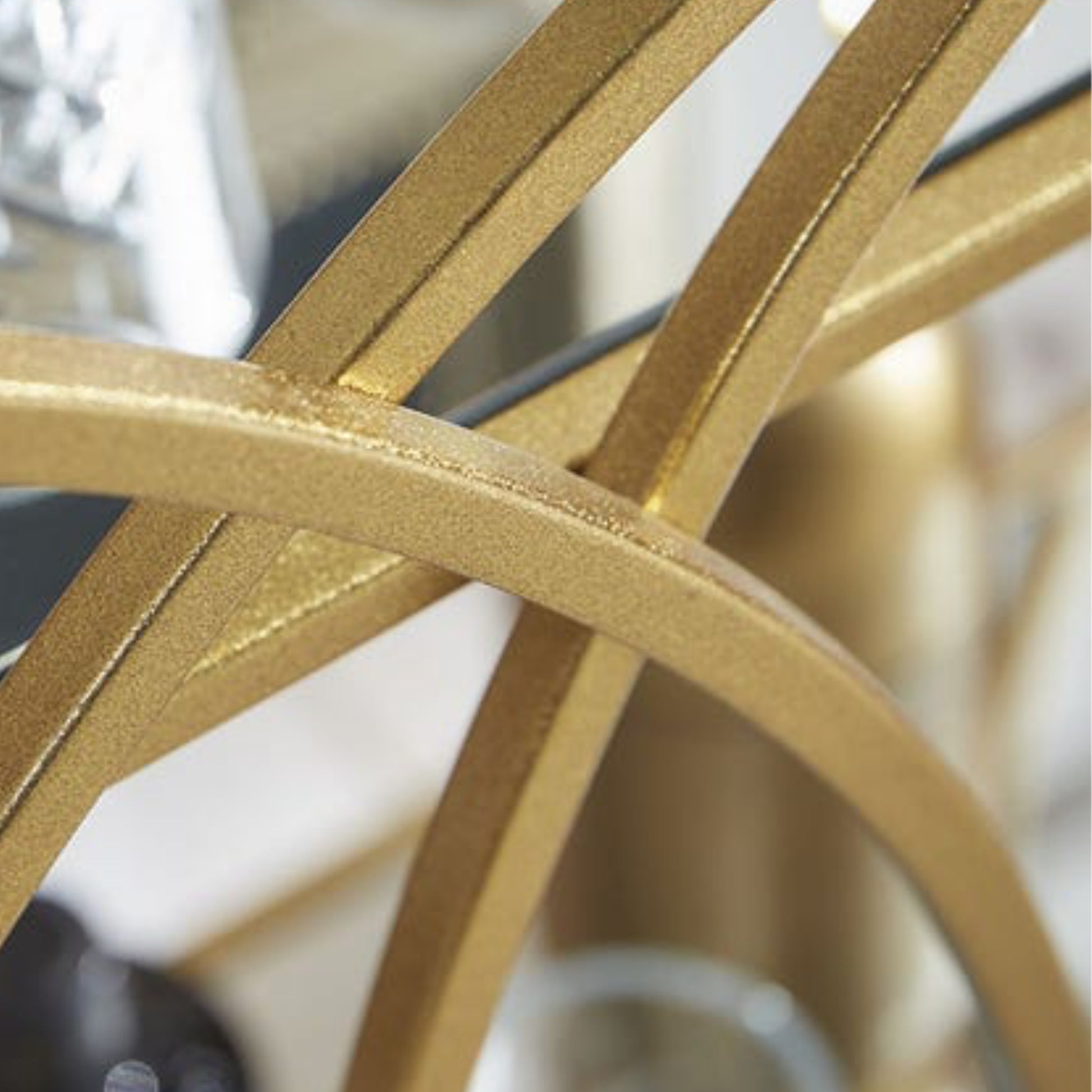 Close-up of a gold metal object with a blurred background