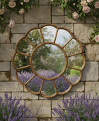 Decorative mirror with floral and stone wall background