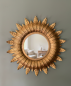 Decorative sunburst mirror on a wall