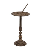 Decorative bronze sundial on a white background
