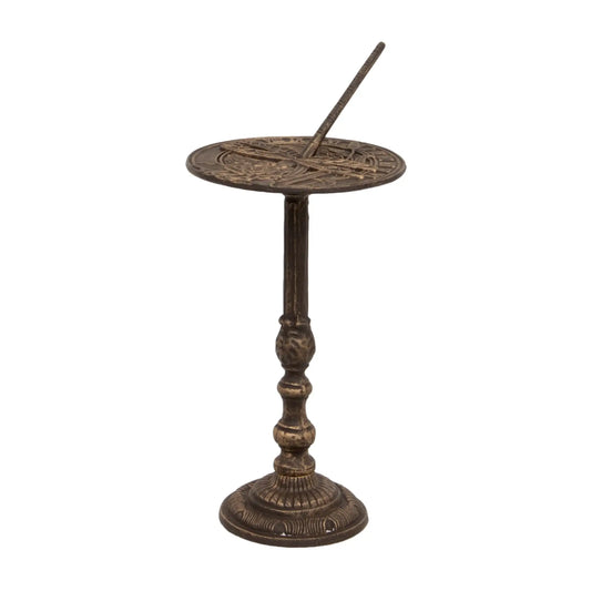 Decorative bronze sundial on a white background