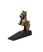 Bronze dog-shaped door stopper on a white background