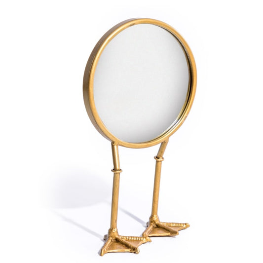 Gold magnifying glass with a white round lens on a white background
