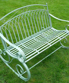Decorative metal bench on a grassy background