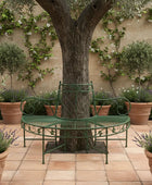 Wrought iron bench with decorative backrest on a wooden floor