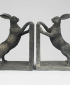 Pair of bronze rabbit bookends on a white background