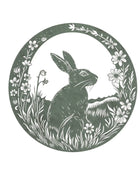 Silhouette of a rabbit surrounded by flowers in a circular frame on a white background