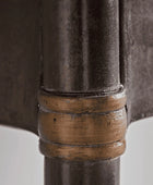 Close-up of a metal pipe with a bronze fitting on a white background