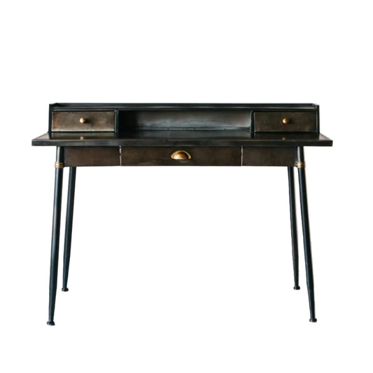 Black desk with drawers on a white wooden floor and light gray wall