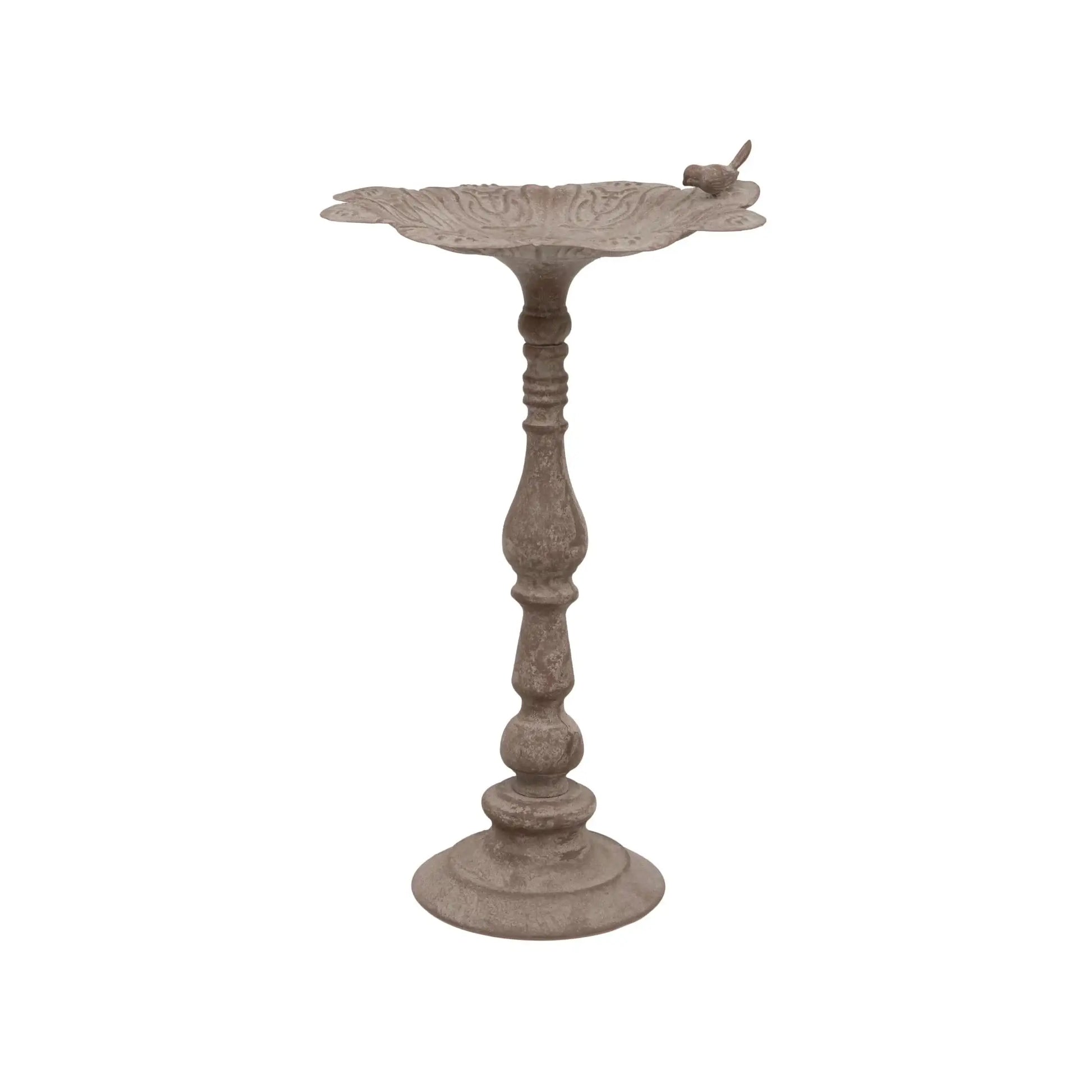 Decorative metal bird bath on a white background