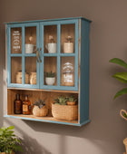 Blue wall cabinet with glass doors displaying various items in a room with plants and decor.