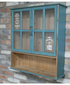 Wooden cabinet with glass doors against a stone wall