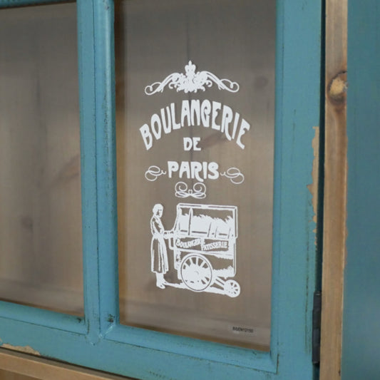 Vintage-style window with 'Boulangerie de Paris' sign on a blue frame.