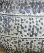 Close-up of a textured ceramic bowl with speckled pattern