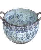 Decorative pot with speckled design and handles on a wooden surface.