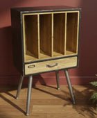 Wooden cabinet with metal legs against a red wall