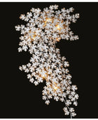 Decorative light fixture with white floral design on a black background