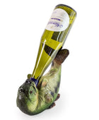 A novelty wine bottle holder shaped like a fish, holding a green glass wine bottle diagonally against a white background.