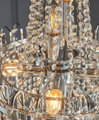 Close-up of a chandelier with crystal beads and metallic structure.