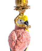 Decorative flamingo figurine with a yellow top on a white background