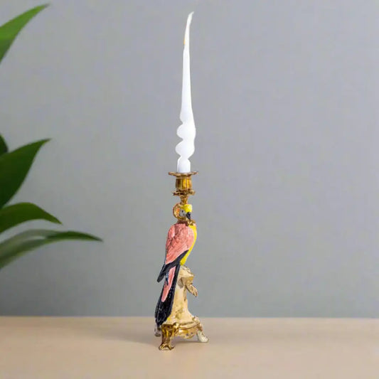 Decorative candle holder with a parrot design on a plain background