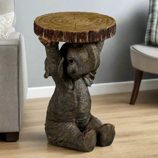 Decorative side table shaped like a sitting elephant with a wooden top on a white background