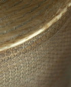 Close-up of a textured metallic surface with intricate patterns