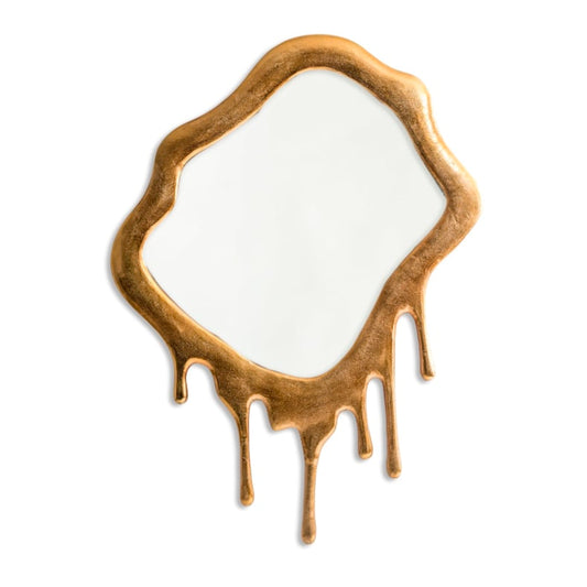 Decorative mirror with a gold frame and dripped design on a white background