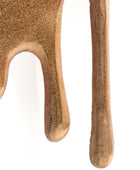 Close-up of a brown leather glove with a textured surface on a white background