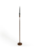 Tall floor lamp with a decorative design on a white background