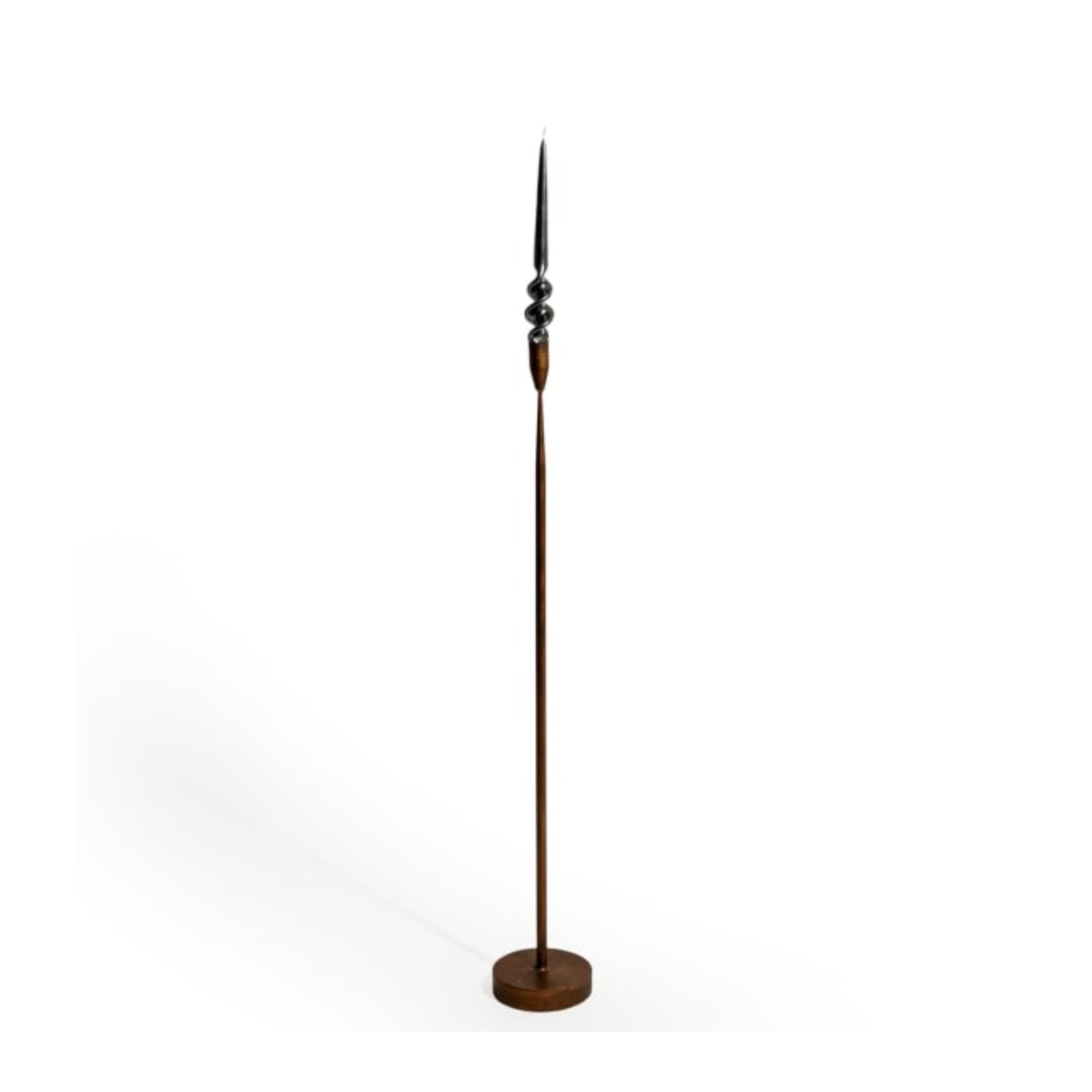 Tall floor lamp with a decorative design on a white background