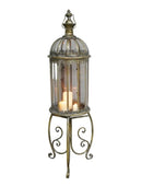 Decorative lantern with candles inside on a plain background