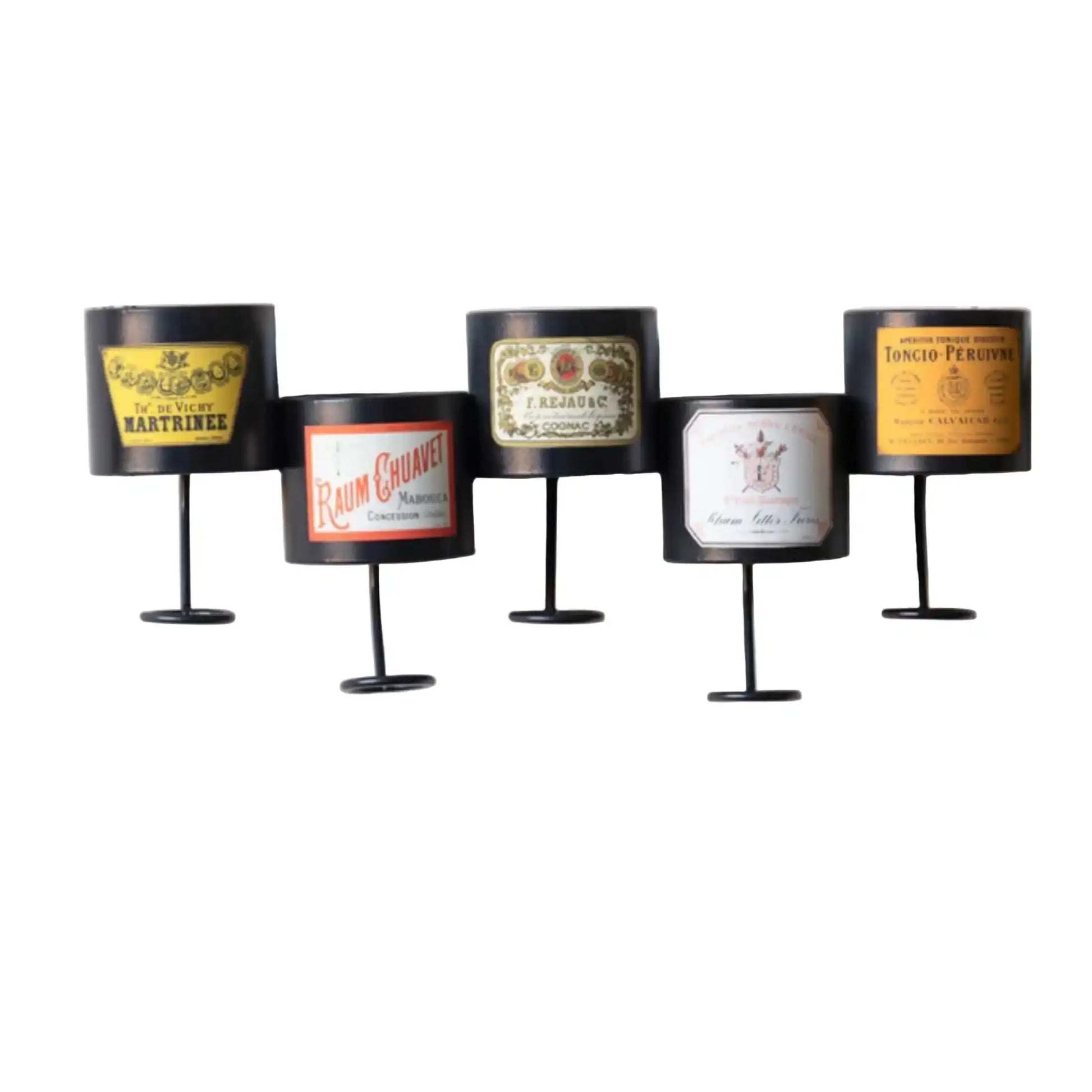 Five cylindrical candles with vintage label designs on a white background