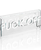 Clear acrylic sign with 'FUCK OFF' in white letters on a white background