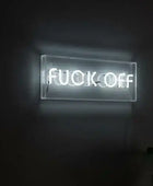 Neon sign with the word 'FUCK OFF' on a black background