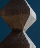 Close-up of a textured brown and gray object with geometric design